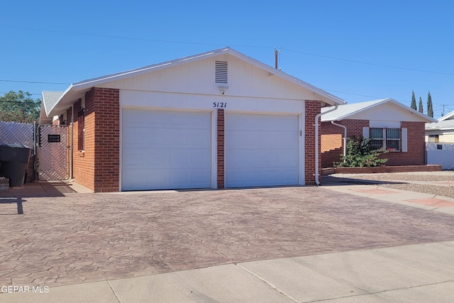 5121 Orleans Ave, El Paso, TX 79924 - single story home with decorative driveway, brick siding, and a gate