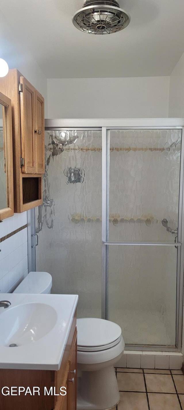 5121 Orleans Ave, El Paso, TX 79924 - bathroom featuring vanity, tile patterned flooring, and a shower stall