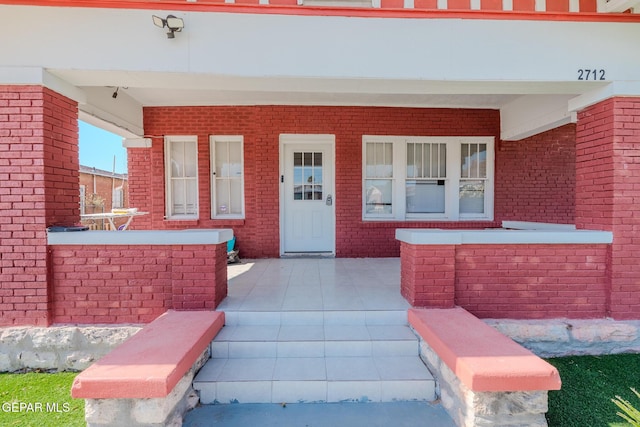 2712 Federal Ave, El Paso, TX 79930 - property entrance featuring brick siding and covered porch