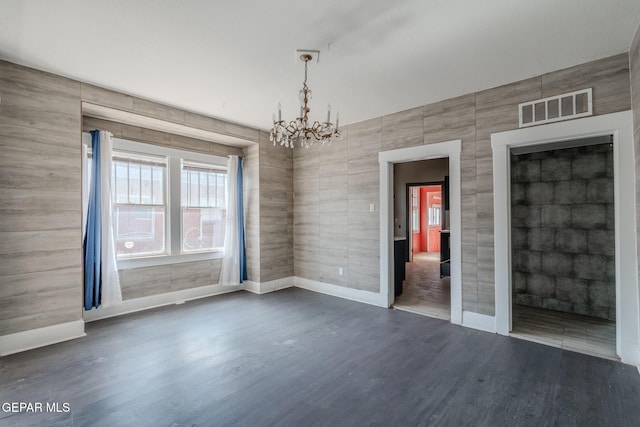 2712 Federal Ave, El Paso, TX 79930 - unfurnished room with wood finished floors, a chandelier, and baseboards