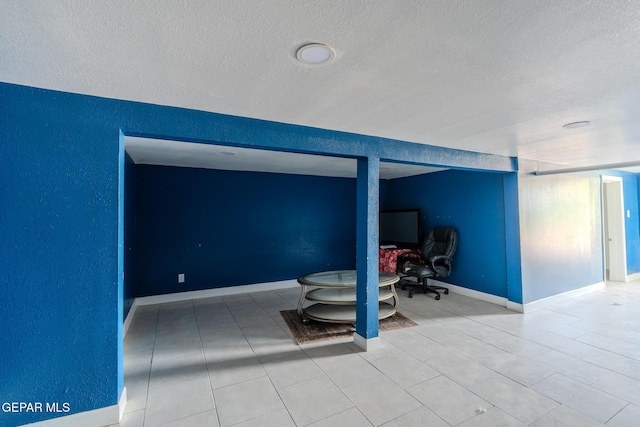2712 Federal Ave, El Paso, TX 79930 - bedroom featuring a textured ceiling, a desk, and baseboards