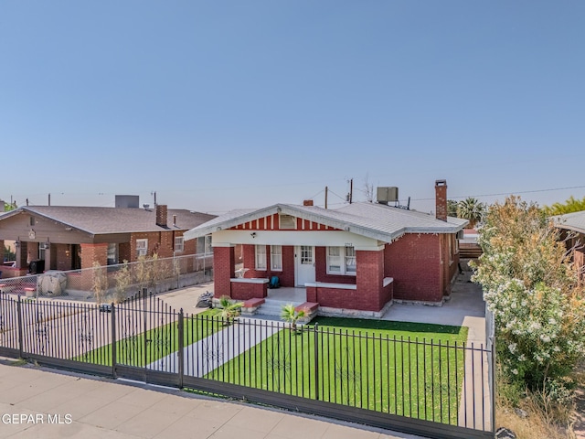 2712 Federal Ave, El Paso, TX 79930 - bungalow-style house featuring brick siding, a chimney, and central air condition unit
