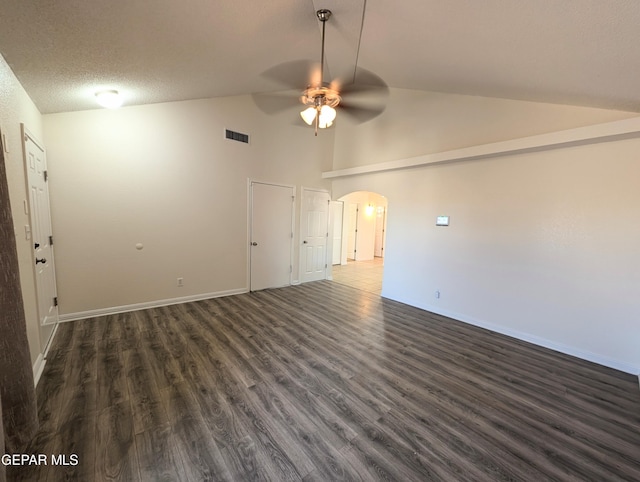 11740 Autumn Wheat Dr, El Paso, TX 79934 - spare room featuring ceiling fan, arched walkways, dark wood-type flooring, baseboards, and high vaulted ceiling