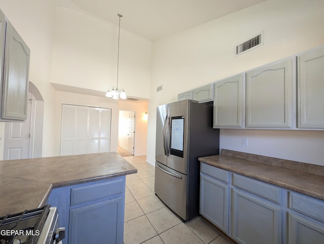 11740 Autumn Wheat Dr, El Paso, TX 79934 - kitchen with smart refrigerator, high vaulted ceiling, range, a chandelier, and light tile patterned floors