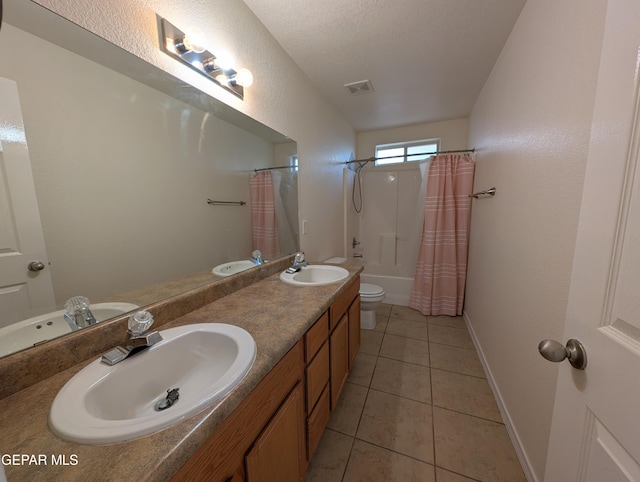 11740 Autumn Wheat Dr, El Paso, TX 79934 - full bath featuring double vanity, shower / bath combo, toilet, tile patterned floors, and baseboards
