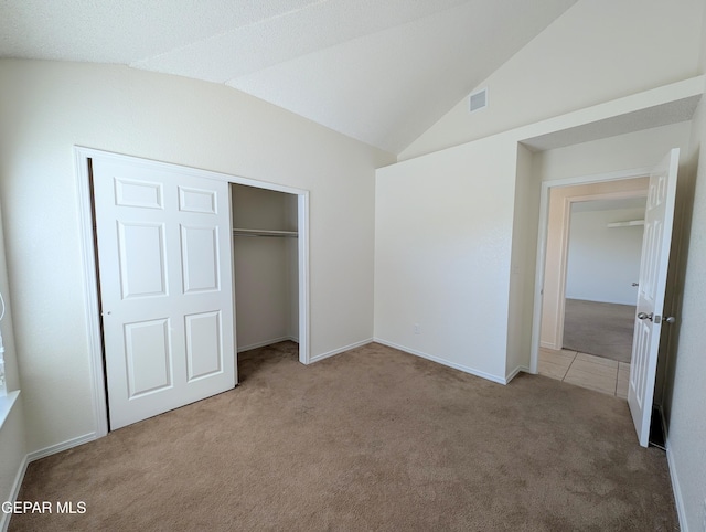 11740 Autumn Wheat Dr, El Paso, TX 79934 - unfurnished bedroom with carpet flooring, vaulted ceiling, a closet, and baseboards