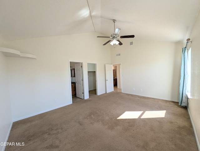 11740 Autumn Wheat Dr, El Paso, TX 79934 - unfurnished bedroom featuring carpet, high vaulted ceiling, baseboards, and a spacious closet