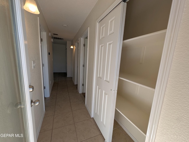11740 Autumn Wheat Dr, El Paso, TX 79934 - corridor featuring light tile patterned floors