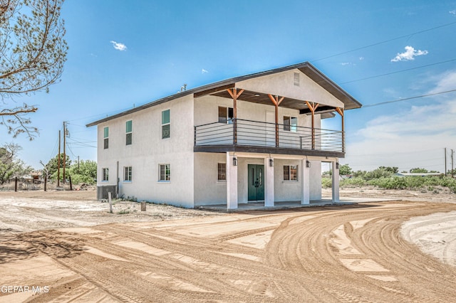 13090 Socorro Rd, San Elizario, TX 79849 - view of front of house featuring a balcony and stucco siding