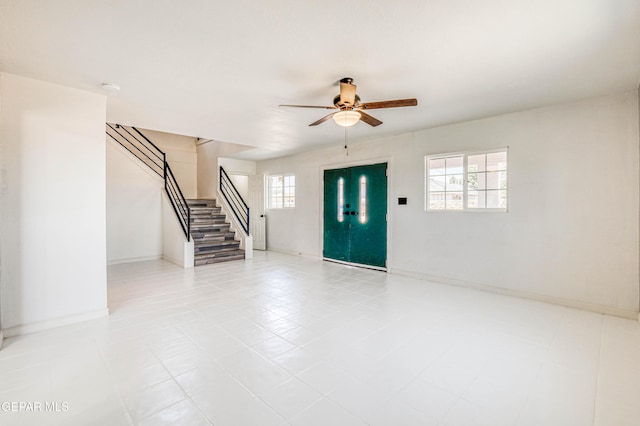 13090 Socorro Rd, San Elizario, TX 79849 - entrance foyer with stairway, a ceiling fan, and baseboards