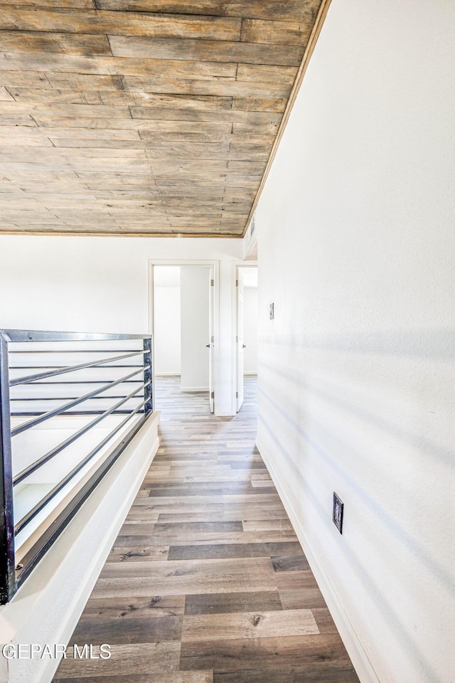 13090 Socorro Rd, San Elizario, TX 79849 - hall with wooden ceiling, baseboards, wood finished floors, and vaulted ceiling