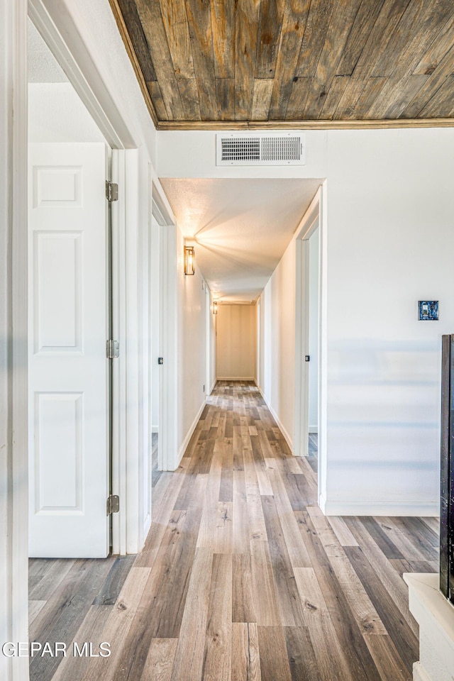 13090 Socorro Rd, San Elizario, TX 79849 - hall featuring wood finished floors, wooden ceiling, and baseboards