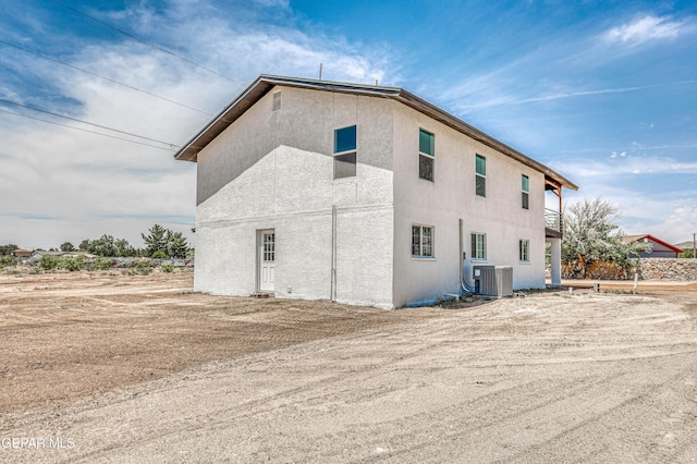 13090 Socorro Rd, San Elizario, TX 79849 - view of property exterior featuring central air condition unit and stucco siding