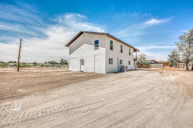 13090 Socorro Rd, San Elizario, TX 79849 - view of property exterior featuring cooling unit and stucco siding