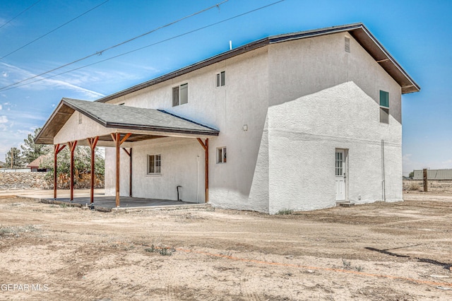 13090 Socorro Rd, San Elizario, TX 79849 - back of property with stucco siding and a patio area