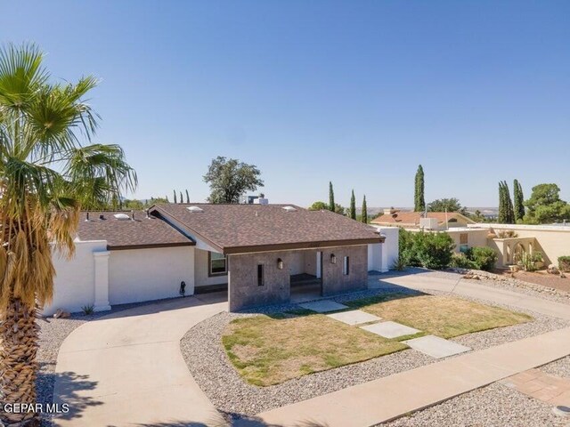 6504 Camino Fuente Dr, El Paso, TX 79912 - single story home with roof with shingles, driveway, and stucco siding