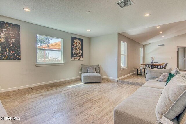 6504 Camino Fuente Dr, El Paso, TX 79912 - living area featuring wood finished floors, baseboards, recessed lighting, and a textured ceiling