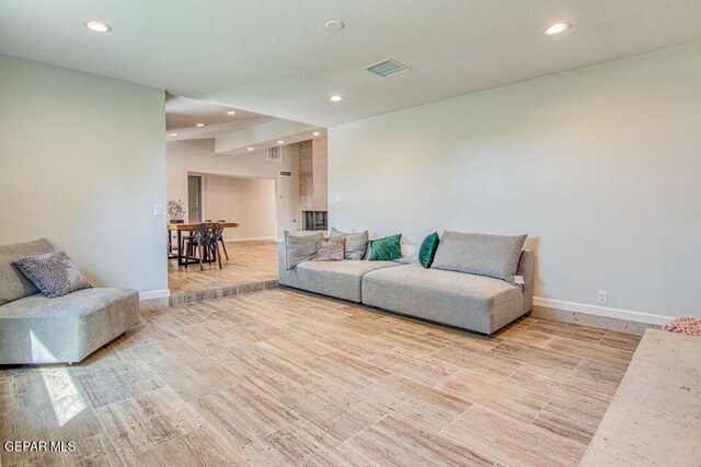 6504 Camino Fuente Dr, El Paso, TX 79912 - living room featuring recessed lighting, baseboards, and light wood finished floors