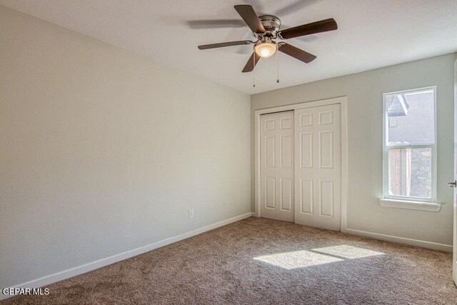 6504 Camino Fuente Dr, El Paso, TX 79912 - unfurnished bedroom with carpet floors, multiple windows, baseboards, and a closet
