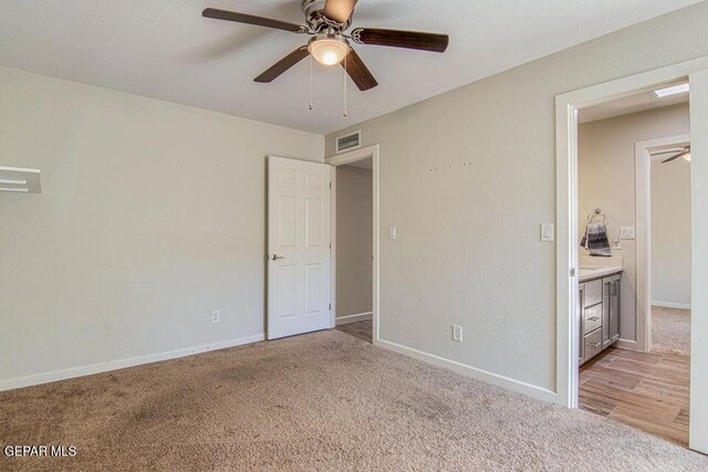 6504 Camino Fuente Dr, El Paso, TX 79912 - unfurnished bedroom with light colored carpet, baseboards, and a ceiling fan