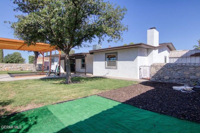 6504 Camino Fuente Dr, El Paso, TX 79912 - back of property featuring stucco siding, a gate, and a patio area