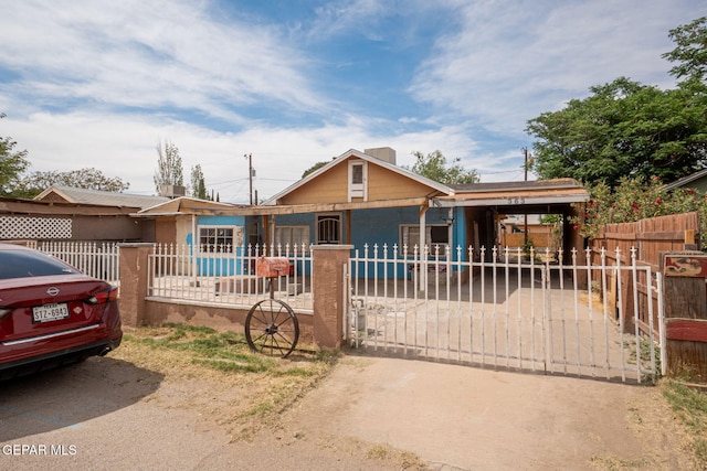363 Ontiveros St, El Paso, TX 79932 - bungalow with a fenced front yard and a carport