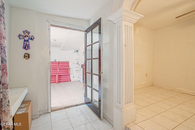 363 Ontiveros St, El Paso, TX 79932 - doorway to outside featuring light tile patterned floors, ornate columns, and a ceiling fan