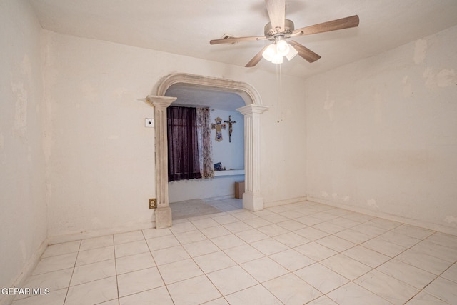 363 Ontiveros St, El Paso, TX 79932 - empty room with decorative columns, a ceiling fan, and light tile patterned floors