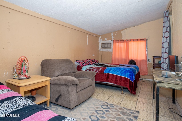 363 Ontiveros St, El Paso, TX 79932 - bedroom with lofted ceiling, a textured ceiling, and tile patterned floors