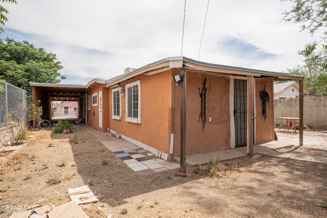363 Ontiveros St, El Paso, TX 79932 - rear view of property with stucco siding