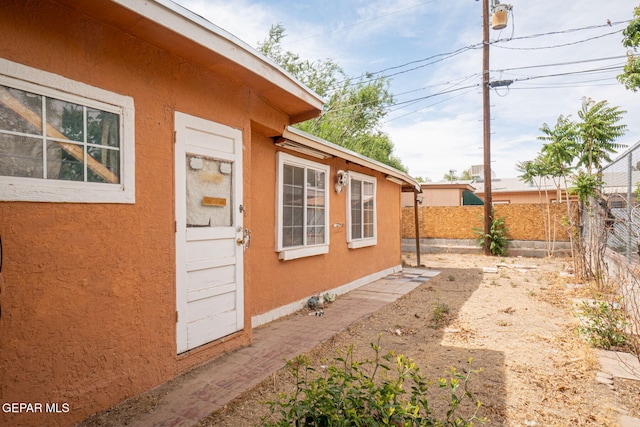 363 Ontiveros St, El Paso, TX 79932 - view of side of property featuring stucco siding and a fenced backyard