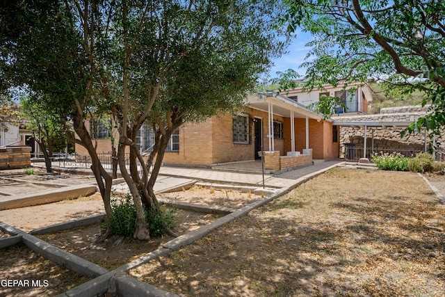 1611 N Kansas St, El Paso, TX 79902 - rear view of house featuring brick siding