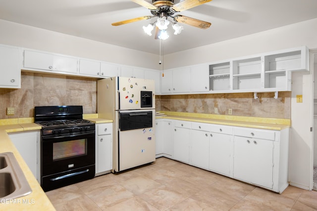 1611 N Kansas St, El Paso, TX 79902 - kitchen featuring black gas range oven, white fridge with ice dispenser, light countertops, and backsplash