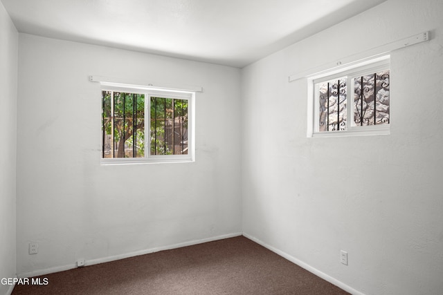 1611 N Kansas St, El Paso, TX 79902 - carpeted empty room with baseboards