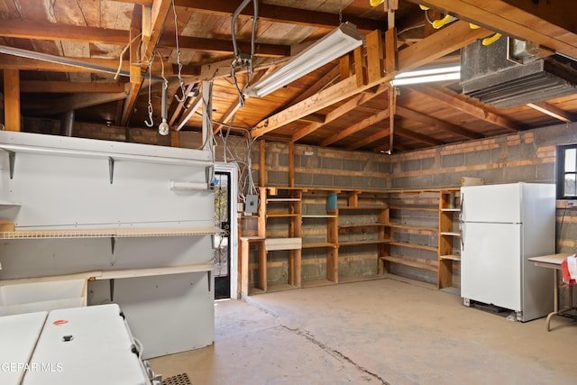 1611 N Kansas St, El Paso, TX 79902 - unfinished below grade area featuring freestanding refrigerator