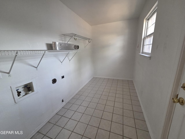 5121 Juliandra Ave, El Paso, TX 79924 - washroom with washer hookup, electric dryer hookup, baseboards, and light tile patterned flooring