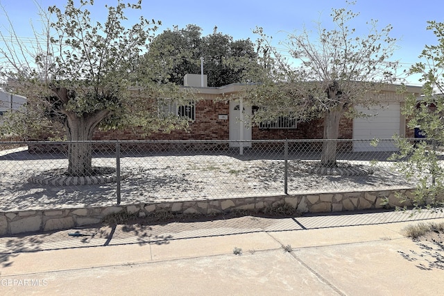 10544 Olga St, El Paso, TX 79924 - view of front of home featuring brick siding and a fenced front yard