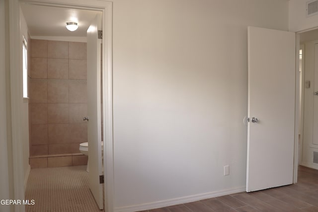 10544 Olga St, El Paso, TX 79924 - unfurnished bedroom with wood finished floors and baseboards