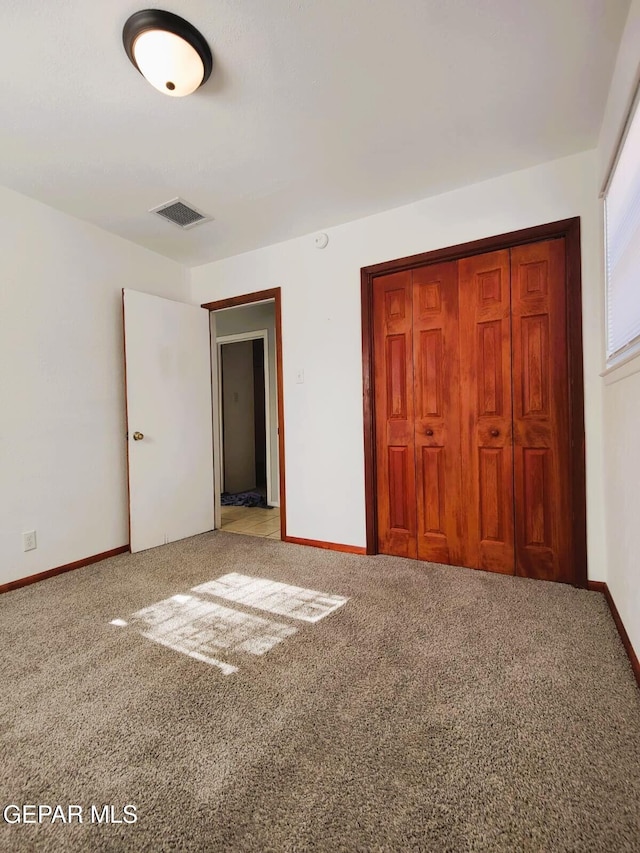 10077 Kirwood St, El Paso, TX 79924 - unfurnished bedroom with carpet, a closet, and baseboards