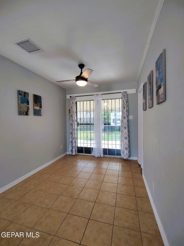 10077 Kirwood St, El Paso, TX 79924 - spare room featuring a ceiling fan, light tile patterned flooring, ornamental molding, and baseboards