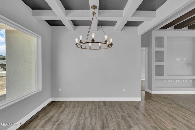 7363 Cimarron Rim Dr, El Paso, TX 79911 - unfurnished room featuring coffered ceiling, wood finished floors, a chandelier, beamed ceiling, and baseboards