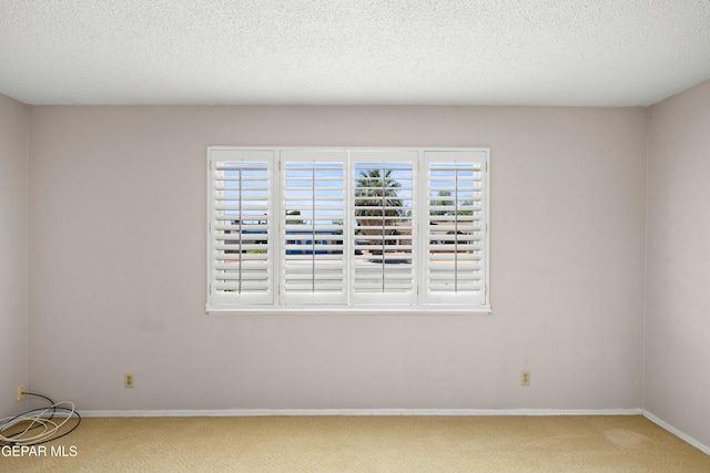 8213 Mineola Dr, El Paso, TX 79925 - empty room featuring carpet flooring, baseboards, and a textured ceiling