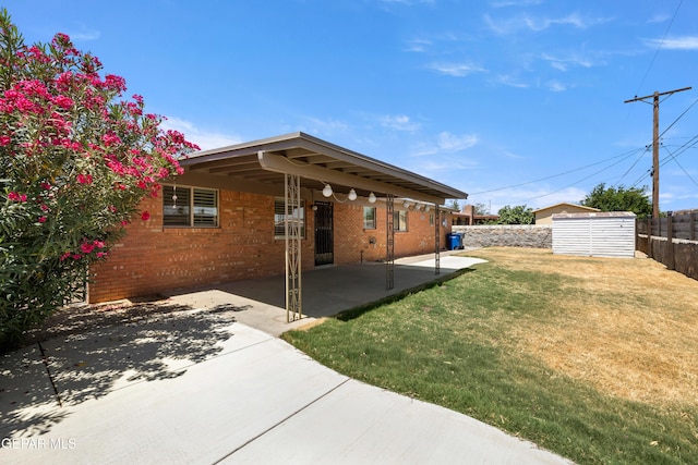 8213 Mineola Dr, El Paso, TX 79925 - back of house featuring a patio area and brick siding