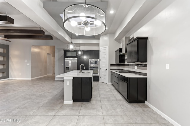 12287 Houghton Spgs, Horizon City, TX 79928 - kitchen with stainless steel appliances, light countertops, dark cabinets, and light tile patterned floors