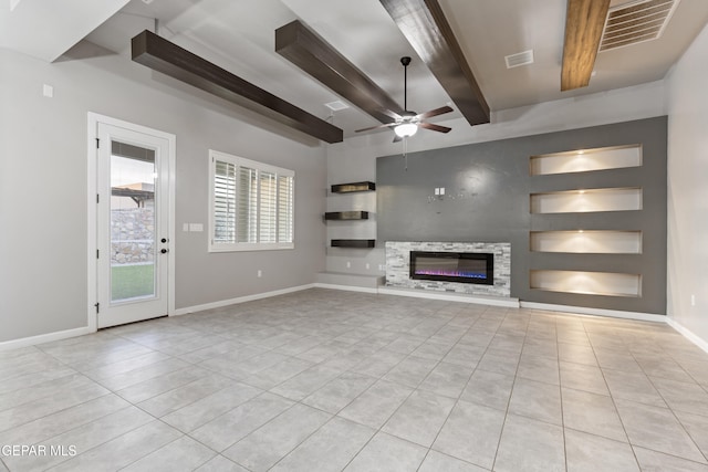 12287 Houghton Spgs, Horizon City, TX 79928 - unfurnished living room featuring tile patterned floors, built in shelves, a ceiling fan, beam ceiling, and baseboards