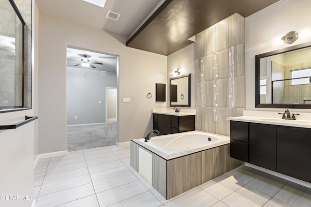 12287 Houghton Spgs, Horizon City, TX 79928 - bathroom with tile patterned floors, a bath, two vanities, a ceiling fan, and baseboards