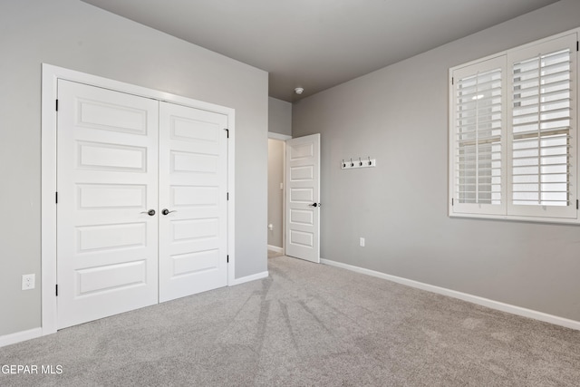 12287 Houghton Spgs, Horizon City, TX 79928 - unfurnished bedroom featuring carpet floors, a closet, and baseboards