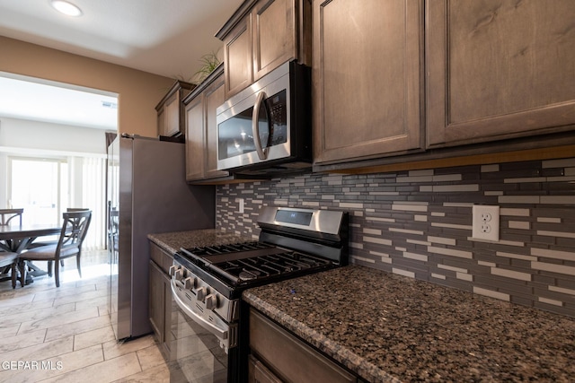 12301 Desert Heights Ct, El Paso, TX 79938 - kitchen featuring stainless steel appliances, decorative backsplash, dark stone counters, recessed lighting, and dark brown cabinets
