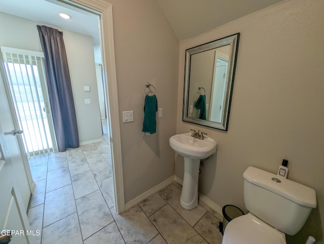 12301 Desert Heights Ct, El Paso, TX 79938 - half bathroom featuring lofted ceiling and marble look tiles