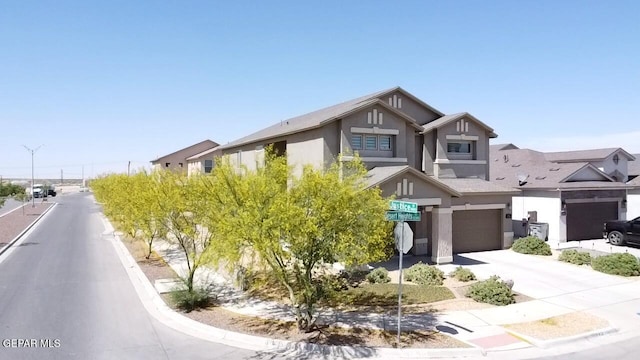12301 Desert Heights Ct, El Paso, TX 79938 - view of front of property with a garage, stucco siding, and driveway